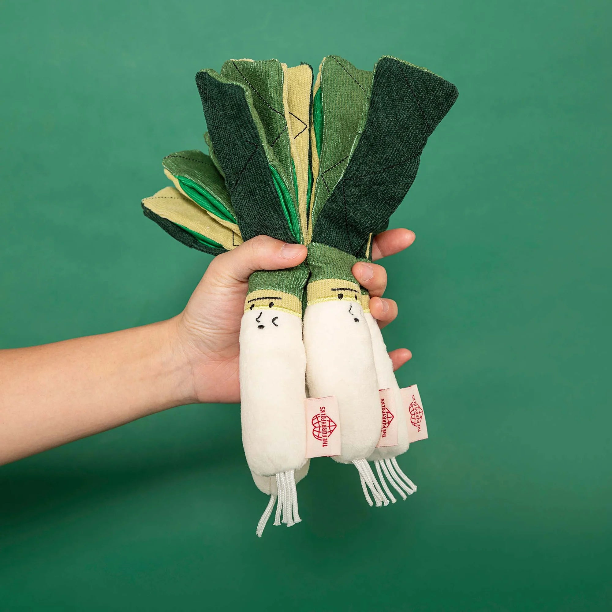 The FurryFolks Green Onion Squeaky Nosework Dog Toy